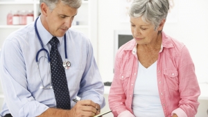 Woman talking to doctor
