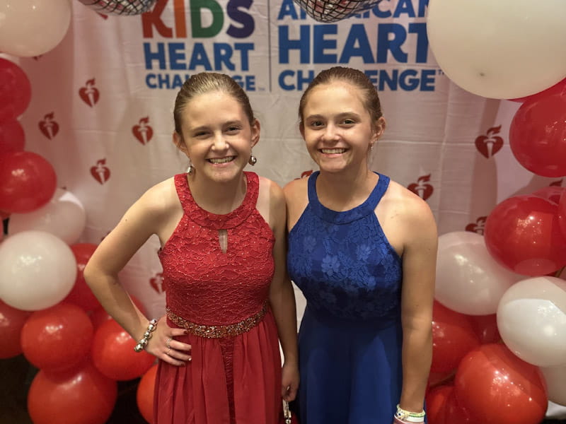 Sykesville Middle School students Sophia (left) and Mia Ferraro met with Heart Association staff members last August to promote the Kids Heart Challenge and American Heart Challenge. The twin sisters love volunteering and speaking to other kids about the importance of the challenges during kickoff assemblies at schools across Maryland. (Photo courtesy of Jennifer Ferraro)