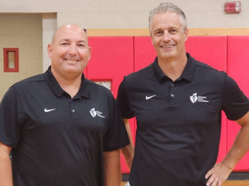 Since 1998, physical education teachers Jason Feid (left) and John Dempsey of North Attleboro Middle School in Massachusetts have run the school's annual educational event and fundraiser benefiting the Heart Association. In 2023, their efforts earned them the Outstanding Team of the Year award from the Heart Association. (Photo courtesy of Jason Feid)