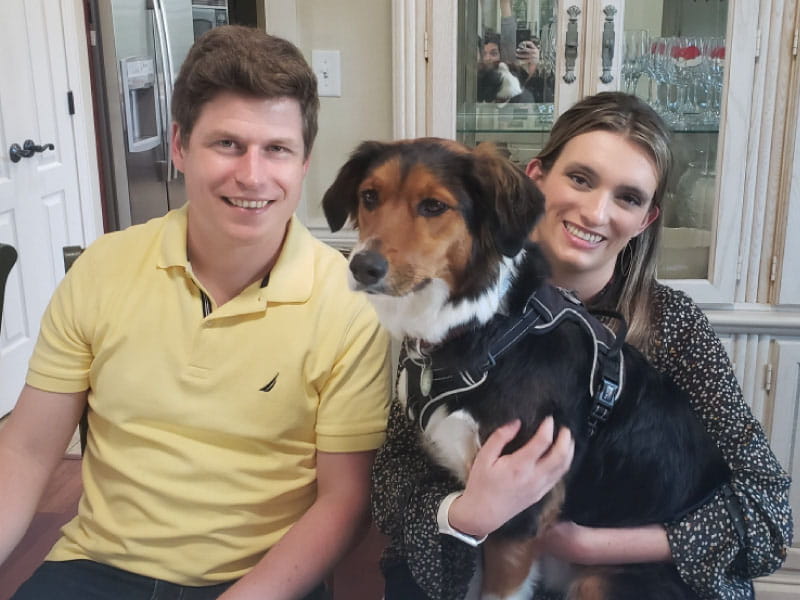 Cardiac arrest survivor Ken Walsh (left) with his wife, Nicole, and their dog, Indiana. (Photo courtesy of the Walsh family)