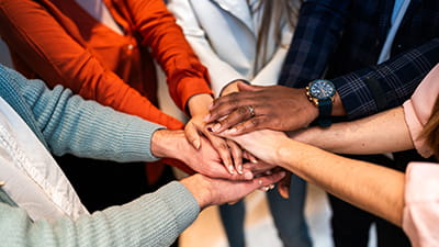 Women's hands all in together