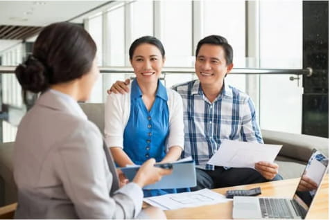 couple talking to advisor in office