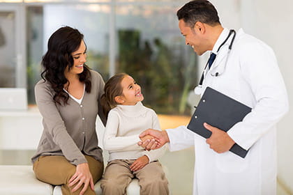 Dr with Latino mom and daughter