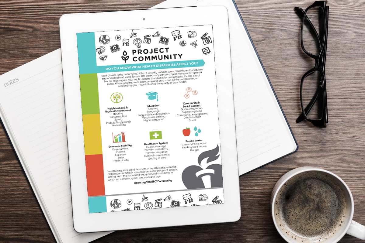 Tablet on a desk showing Project Community infosheet