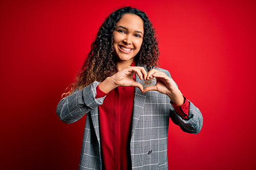 woman holding heart hands