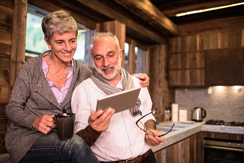 senior couple using tablet