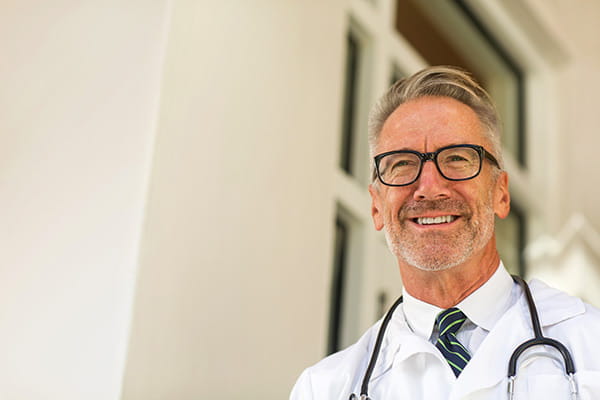 Portrait of mature male doctor at a medical office