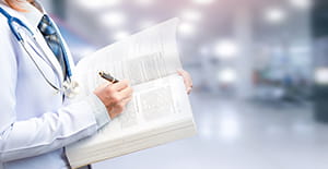 Physician holding journal_lowres