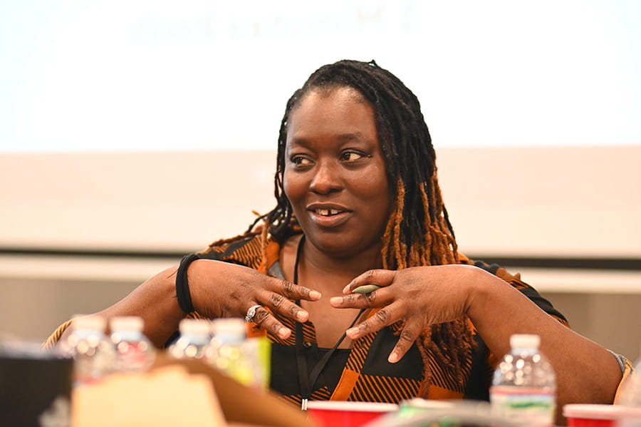 a Rural at Heart volunteer speaking at a table at an event