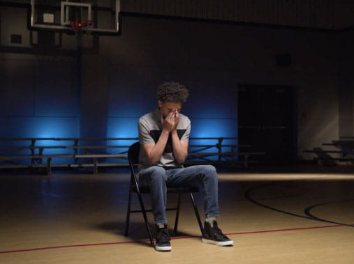 Dra sitting in gymnasium